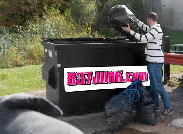 man using a permanent dumpster