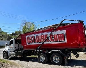 dumpster loaded on a truck
