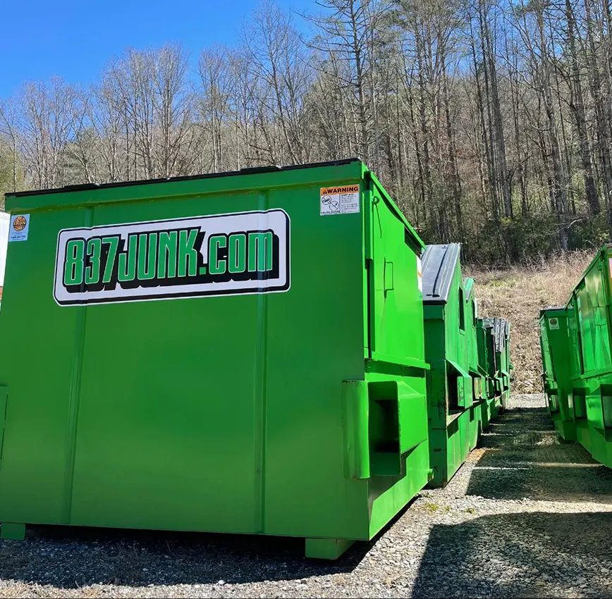 standard dumpsters lined up at 837 junk location