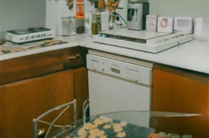 old diswasher in an old victorian style kitchen ready for removal