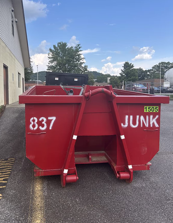 15 yard roll-off dumpster sitting at a commercial address ready to be filled